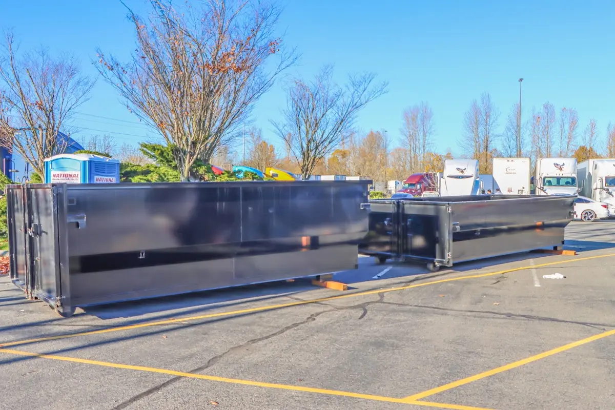 Professional dumpster rental service with roll-off container on residential driveway in Lago Vista